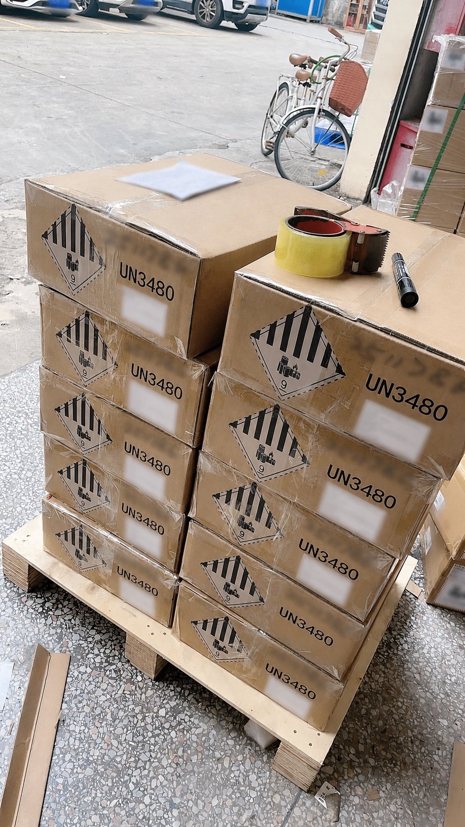 Nine cartons of UN3480 lithium-ion battery packs prepared for UPS dangerous-goods express shipping