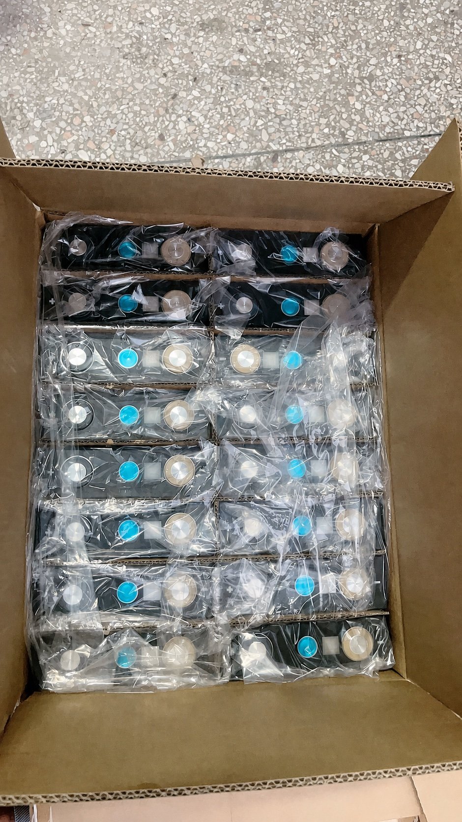 Individually protected lithium-ion battery packs inside a divided cardboard carton