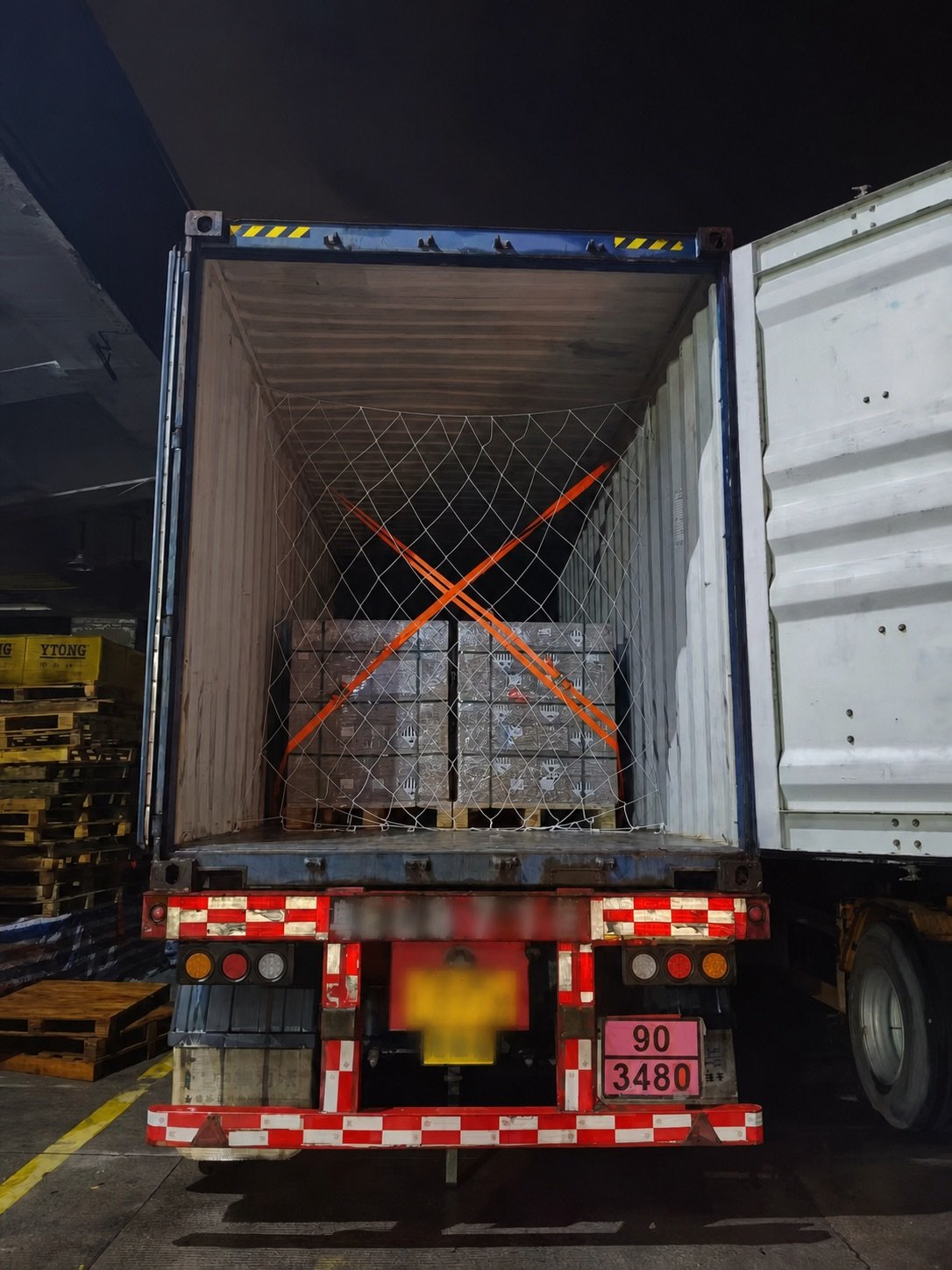 Anonymized UN3480 pallet cargo secured inside a 40HQ container