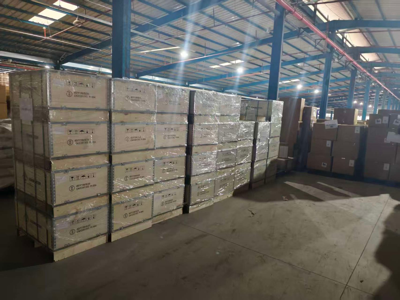 Export battery cases wrapped and staged inside a warehouse
