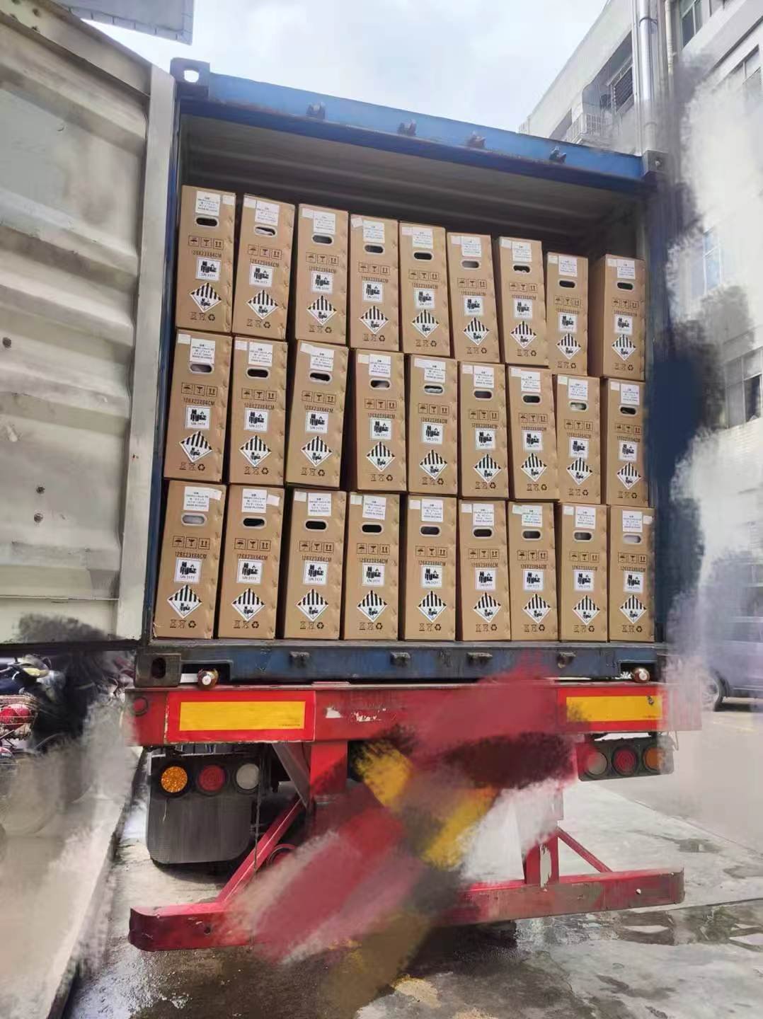 Export cargo being loaded into a shipping container at origin
