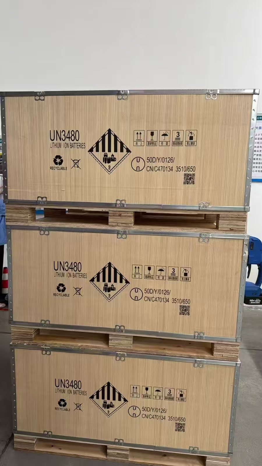 Authorized photograph of UN 3480 lithium-ion battery crates on pallet bases