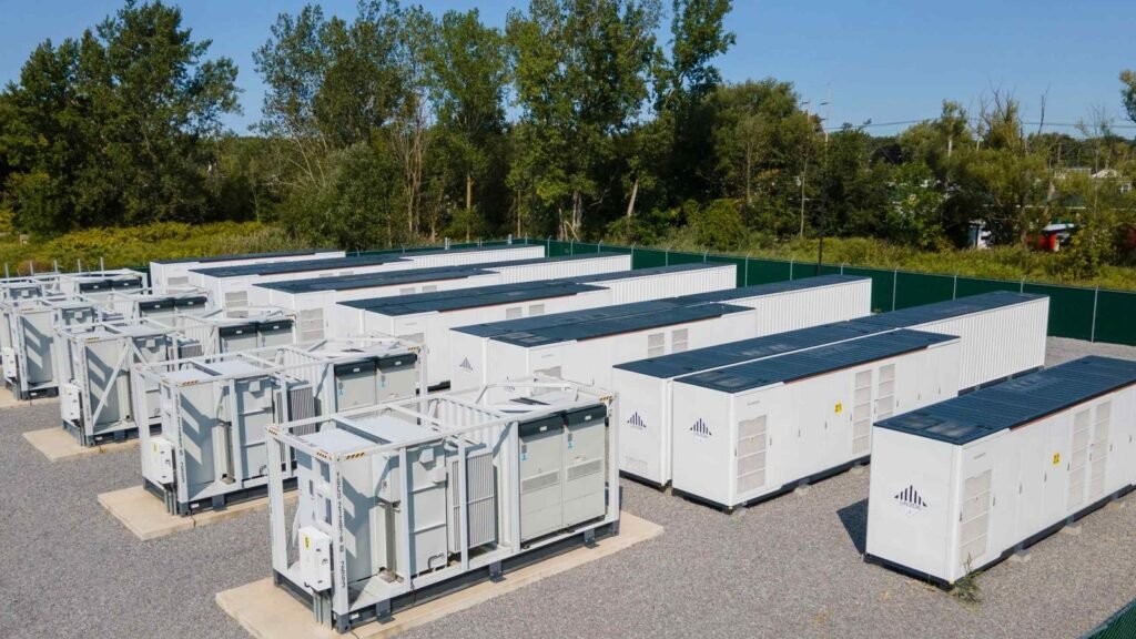 Rows of containerized battery energy storage units in an outdoor yard